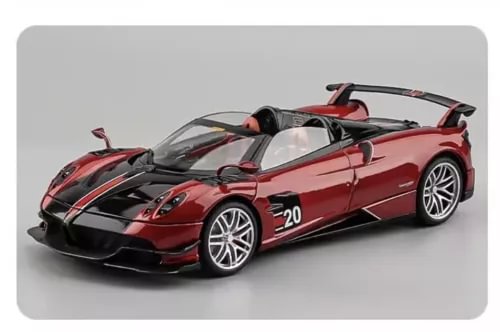 Red and black diecast sports car model with white wheel accents, open cockpit