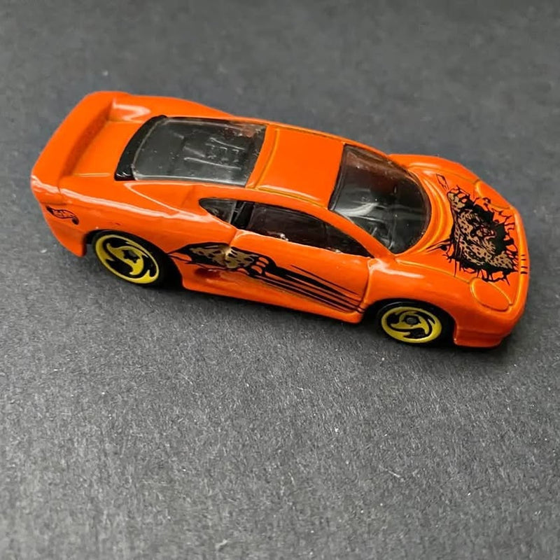 Orange Hot Wheels Jaguar XJ220 diecast sports car, side view