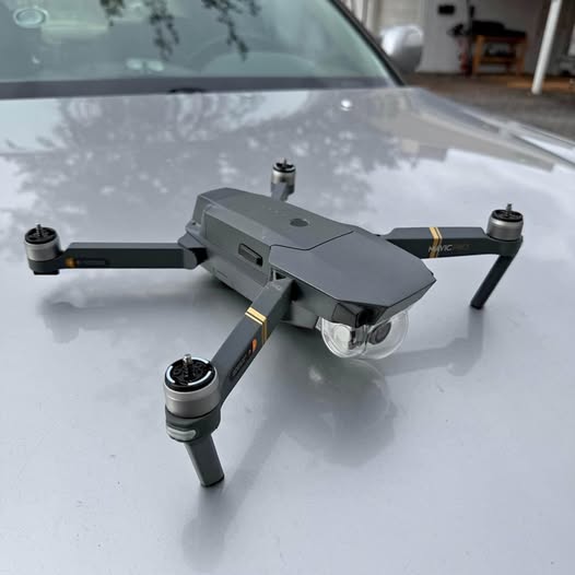DJI Mavic Pro drone with 4 rotors, front camera and landing legs