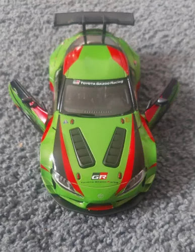 Green and red toy pullback racing car, 1/36 diecast model with front hood details