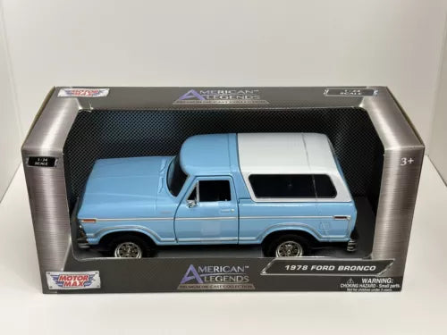 Baby blue 1978 Ford Bronco diecast model with white roof, in retail box