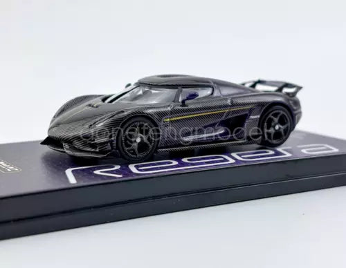 1:64 diecast sports car model with dark carbon-fiber body and purple accents