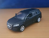 Diecast SUV model car in dark gray, front three-quarter view, realistic details