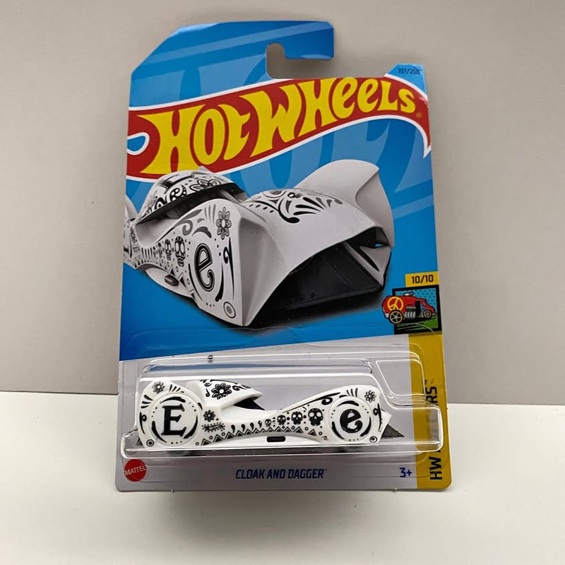 White and black Hot Wheels diecast car with cloak-and-dagger graphic