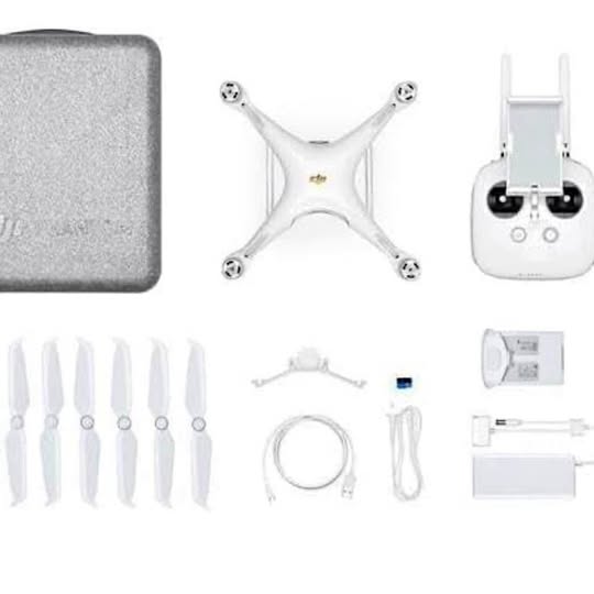 Used DJI Phantom 4 Pro drone parts and accessories, including propellers and charger
