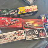 Die-cast car model set in retail boxes with assorted racing designs