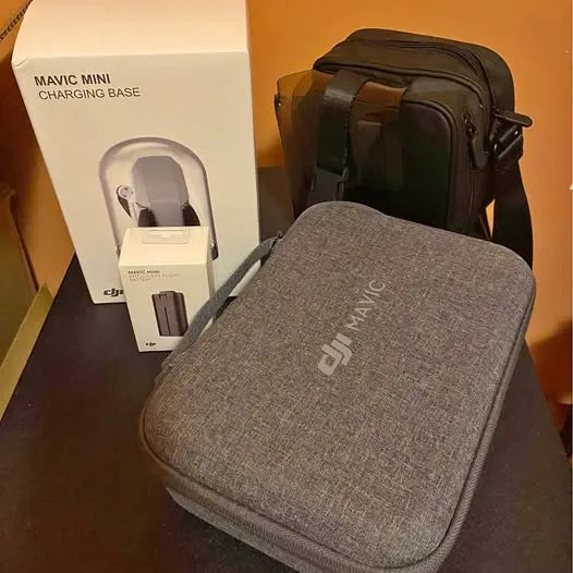Grey hard-sided drone case with zipper and textured finish, DJI logo front.