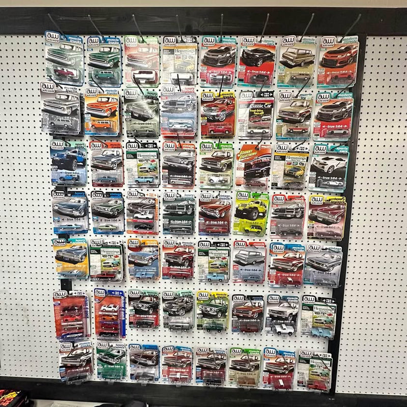 Assorted Auto World diecast cars on retail display card set