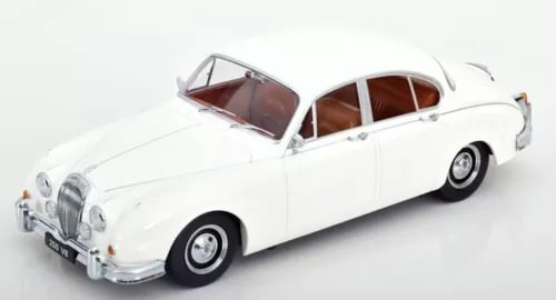 White vintage 1962 LHD diecast car with brown interior, front three-quarter view