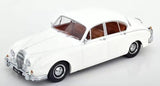 White vintage 1962 LHD diecast car with brown interior, front three-quarter view