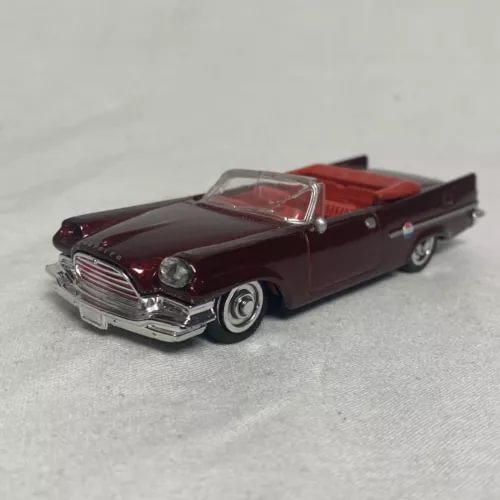 Maroon 1:43 diecast convertible car with chrome grille and front headlights
