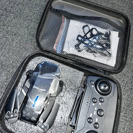 Foldable drone with built-in camera in black hard case