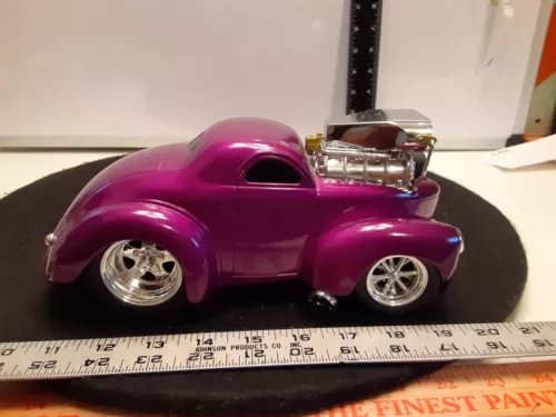 Burgundy metal die-cast coupe car with chrome details and silver wheels