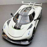 White 1:24 diecast model car with detailed hood and windshield, front three-quarter view
