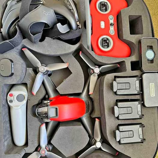 DJI Mavic Pro drone accessories in hard case: drone, controller, batteries, props