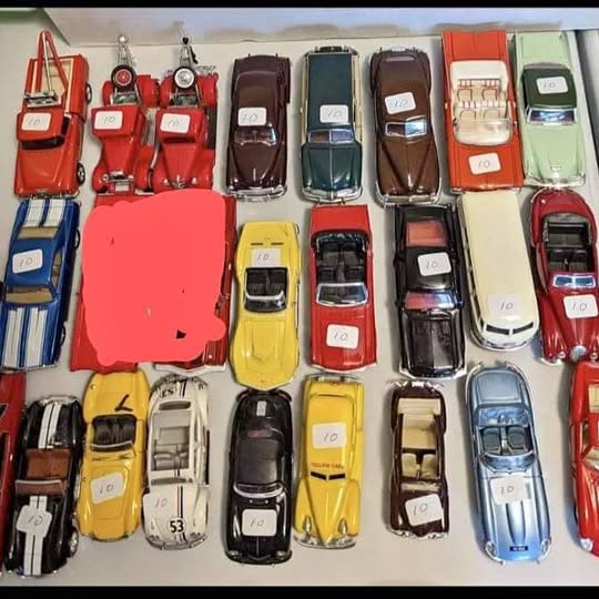 1:43 scale diecast car assortment, mixed colors, in rows
