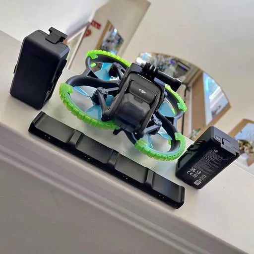 DJI Avata FPV drone with goggles, green prop guards, black body and controller