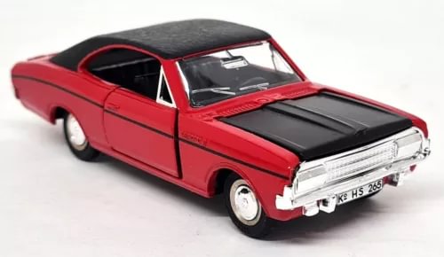 Red diecast model car with black hood and chrome grille, front three-quarter view