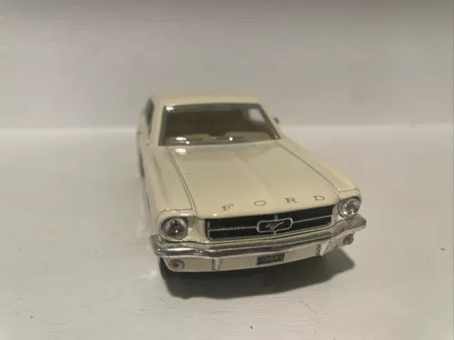 Kinsmart cream white diecast model toy car, front view with grille and headlights