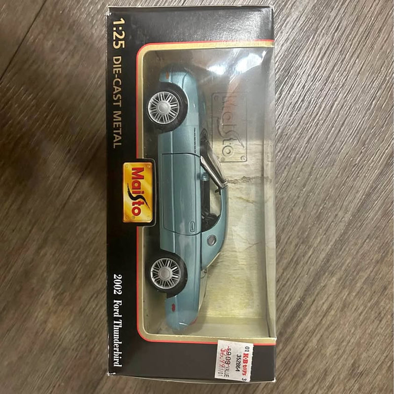 Light blue 2002 Ford Thunderbird diecast car in box, Maisto 1:24