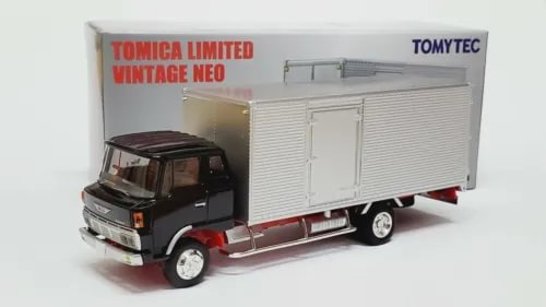 Diecast box truck model with dark cab and white cargo box, side view