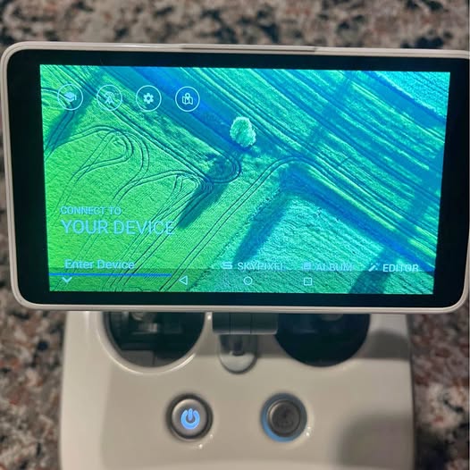 Drone remote controller with touchscreen display and two front buttons