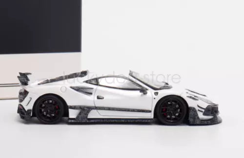 White sports diecast metal car, side view with black wheels and dark accents