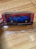 Blue 1/24 diecast metal car model in clear display case with red base
