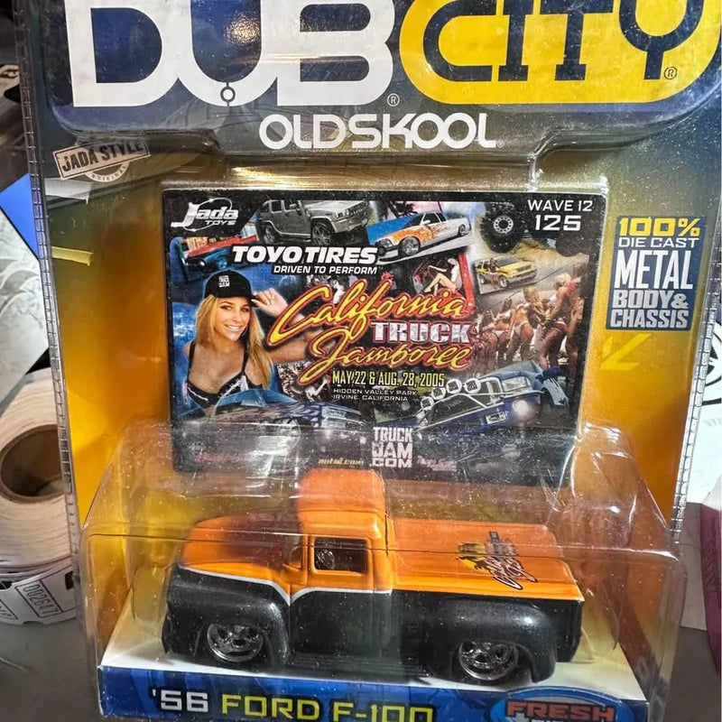 Diecast 56 Ford F-100 pickup toy in clear window box, orange and black