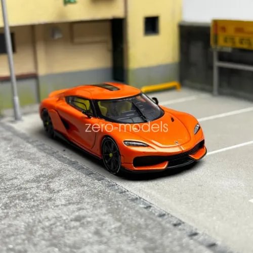 1/64 scale diecast sports car model, orange with black wheels, front view