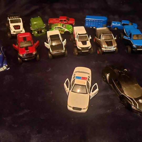 Small diecast toy vehicle set with assorted cars, including a white car in front