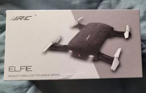 Foldable mini selfie drone with camera, four propellers, dark body