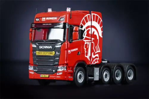 Red diecast truck model cab with white graphic decals and 8x4 wheels