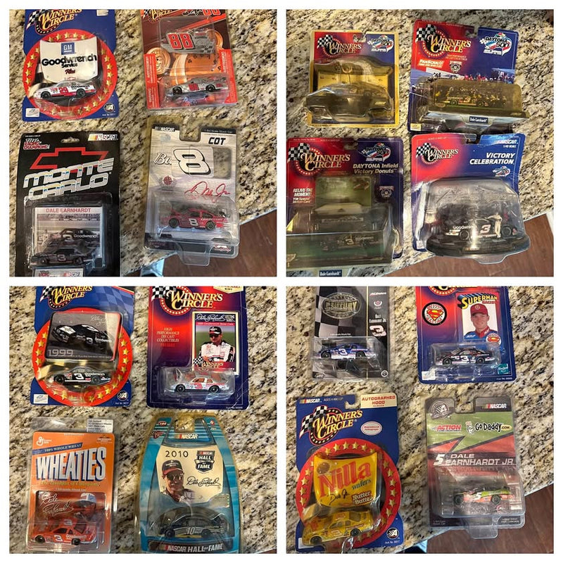 Multiple NASCAR diecast cars in blister packs, various race car designs