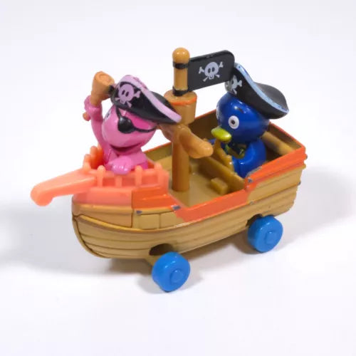 Pirate boat toy with pink and blue character figures on a yellow deck