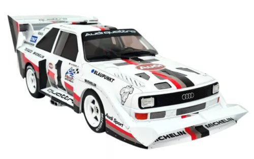 White and red Audi Quattro diecast alloy model car with black racing stripes, front view