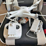 White quadcopter drone with propellers in zip case