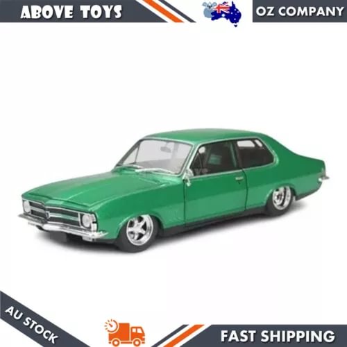 Green diecast car model with black wheels and front grille detail, side view