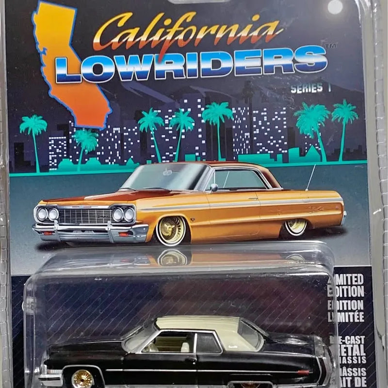 Orange 1973 Cadillac coupe diecast model car in blister packaging, front view