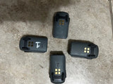 Dark gray drone battery pack shells with exposed gold contacts