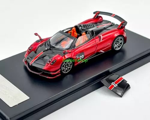 Red sports car diecast model with open cockpit and black wheels