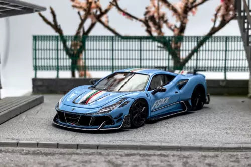 Blue racing diecast model car with black wheels, front 3/4 view, detailed decals
