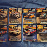 Assorted 1:64 diecast car blister packs with Hot Wheels-style vehicles