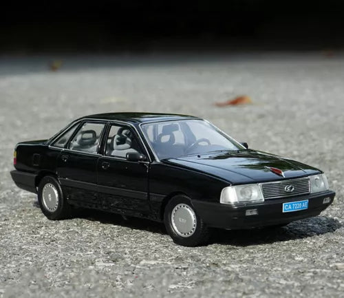 1:18 scale black sedan diecast model car, front 3/4 view with silver grille