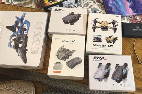 Set of six mini drones with propellers, shown in retail packaging