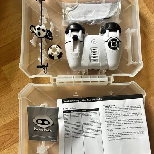 White quadcopter drone with panda-style remote, stored in protective case with accessories