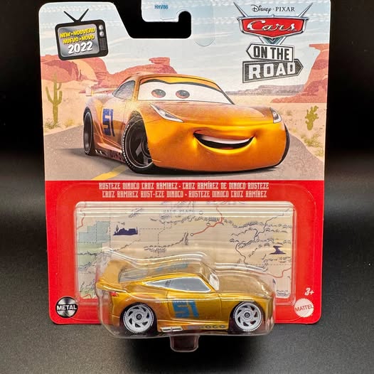 Yellow No. 51 diecast race car in clear blister package, stylized racing graphics