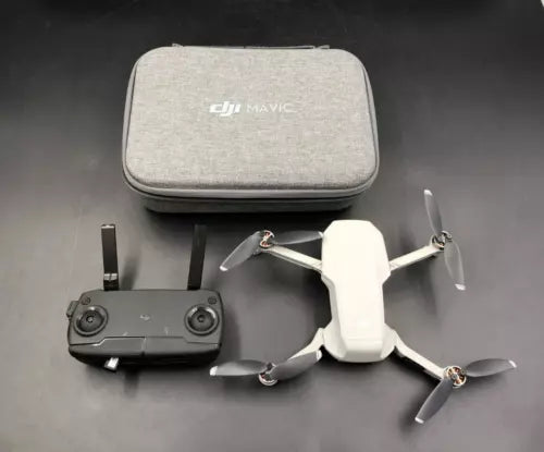 DJI Mavic Mini drone with remote controller and carrying case, with four propellers