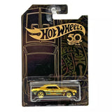 Black and gold 1967 Camaro 1:64 diecast toy in Hot Wheels blister pack