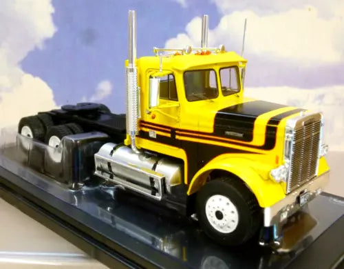 Yellow and black diecast semi truck model with chrome grille and cab